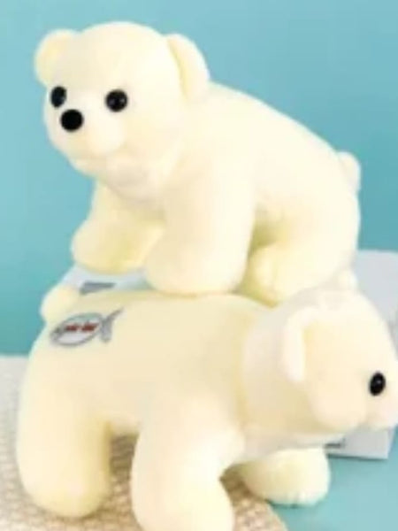 Two white plush polar bears on a light blue background