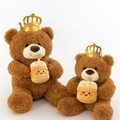 Brown teddy bear wearing crown playing birthday music