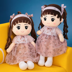 Curly Doll with lifelike curls, sitting upright