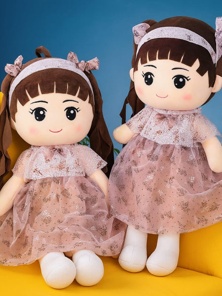 Curly Doll with lifelike curls, sitting upright
