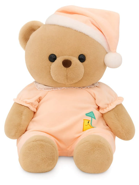Brown teddy wearing festive birthday cap