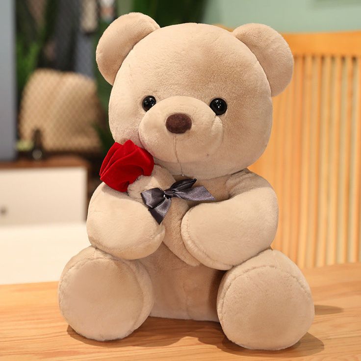 “38 cm beige teddy bear holding a red rose with bow tie”