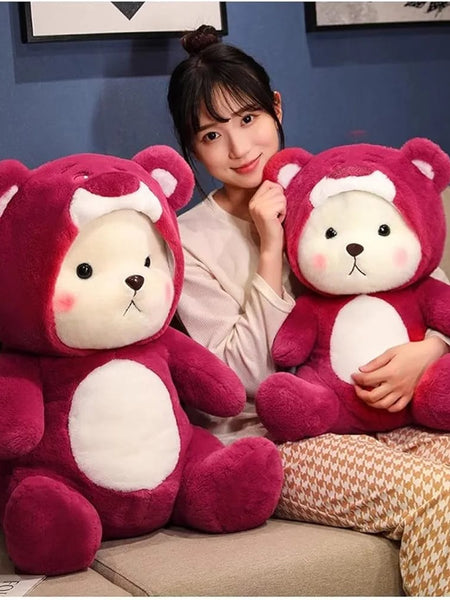 “Cute plush teddy in red hoodie sitting upright”