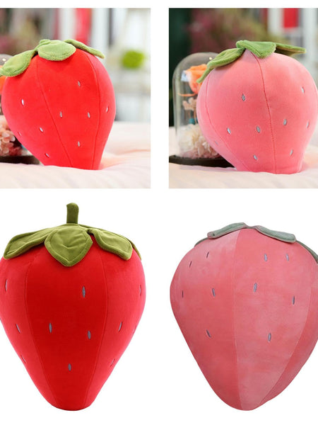 “Small strawberry cushion with green leaf top”